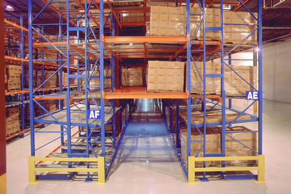 Side view of pallet flow racking system loaded with box