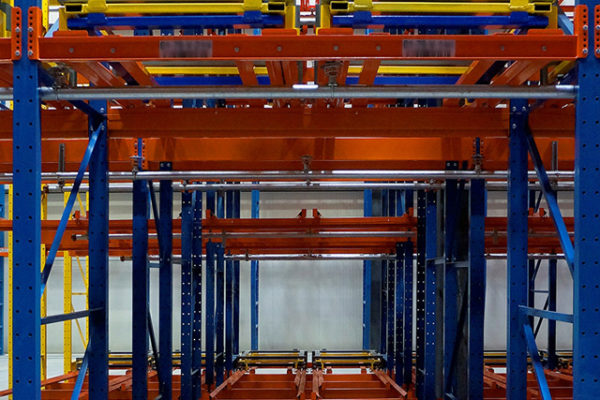 Front view of pushback pallet racking showing pallet depth